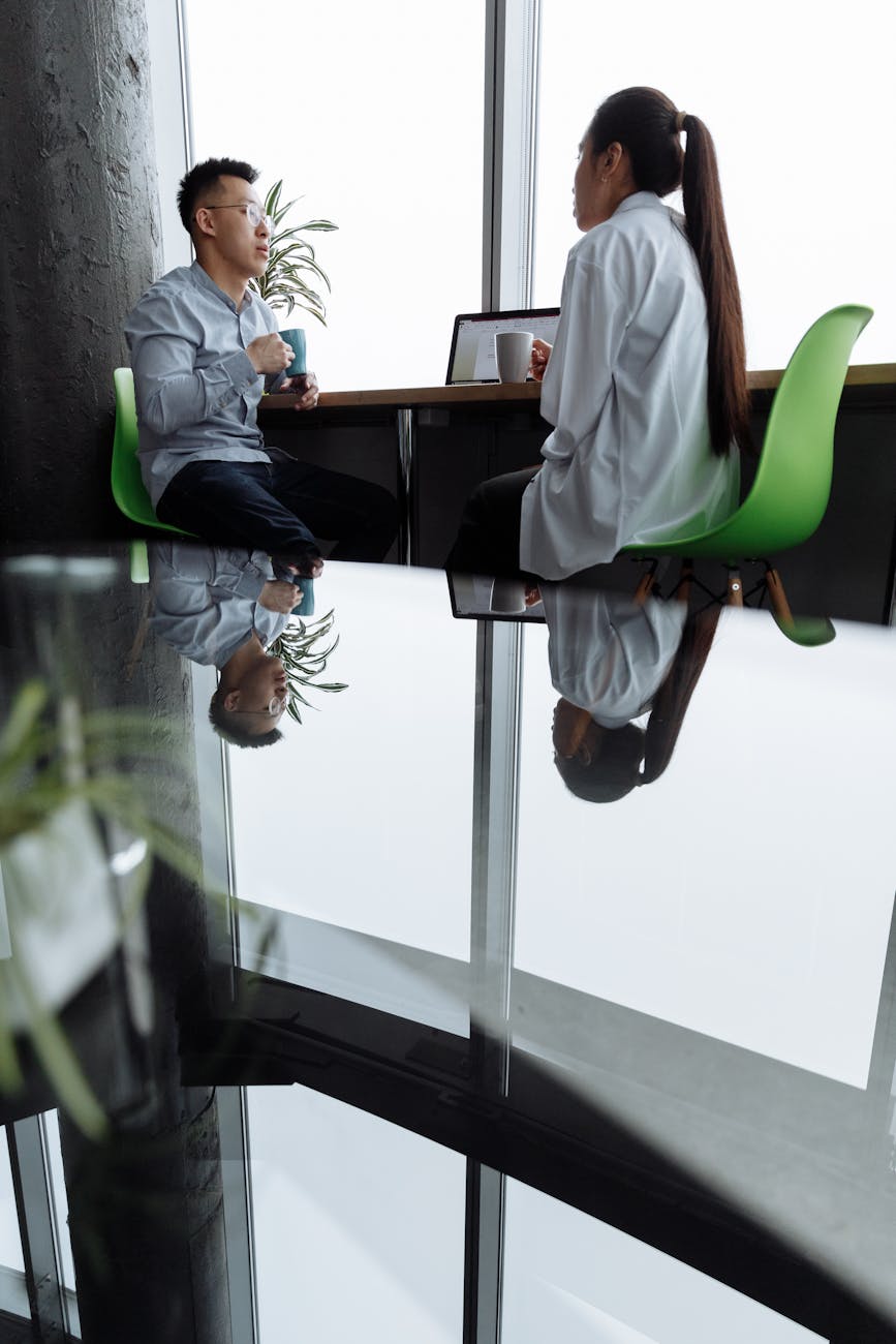 Modern staffing agency office in Miami with glass walls and collaborative workspace