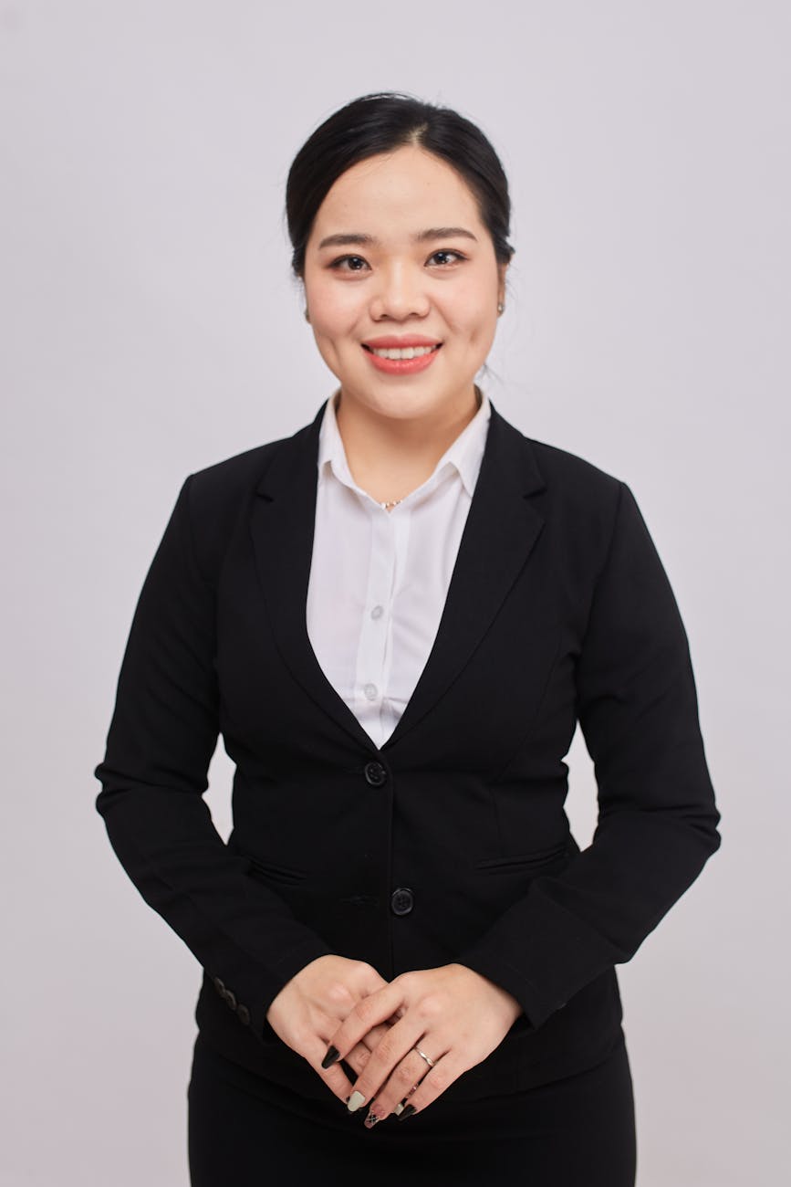Professional headshot of staffing recruiter smiling in business casual attire